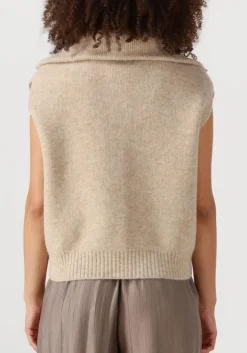 beige knit-ted vest may