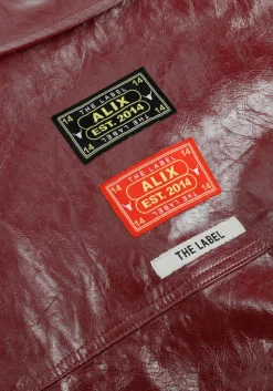 bordeaux alix the label blouses faux leather blouse