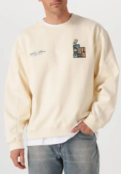 creme filling pieces sweater sweatshirt speaker wall