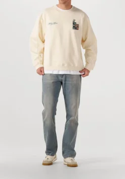 creme filling pieces sweater sweatshirt speaker wall