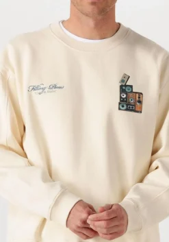 creme filling pieces sweater sweatshirt speaker wall